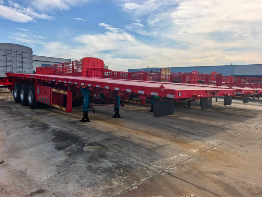 Fabrika Özel 12.5 metre 3 eksenli düz kirişli düz yataklı yarı römork Ağır yük konteyneri Kargo taşıma römoru satılıyor