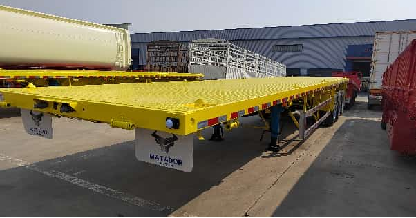 Fabrika Özel 12.5 metre 3 eksenli düz kirişli düz yataklı yarı römork Ağır yük konteyneri Kargo taşıma römoru satılıyor
